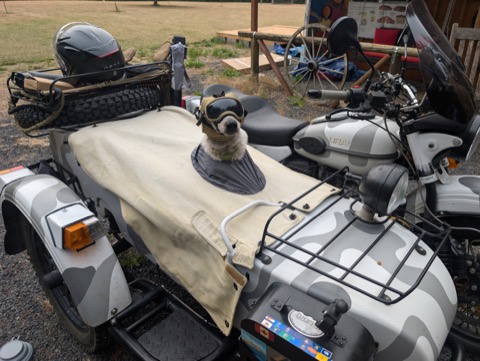 Prototype v1: canvas tonneau, head hatch, tank-crew helmet. Peak submarine commander energy.