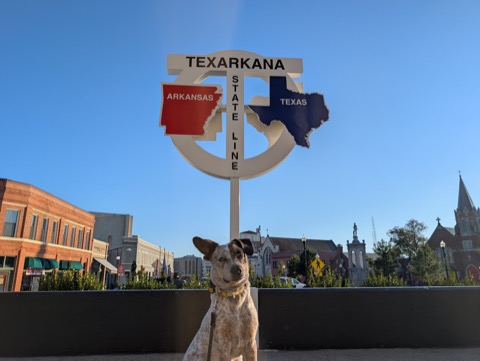 Two states, one sign, one very photogenic dog.
